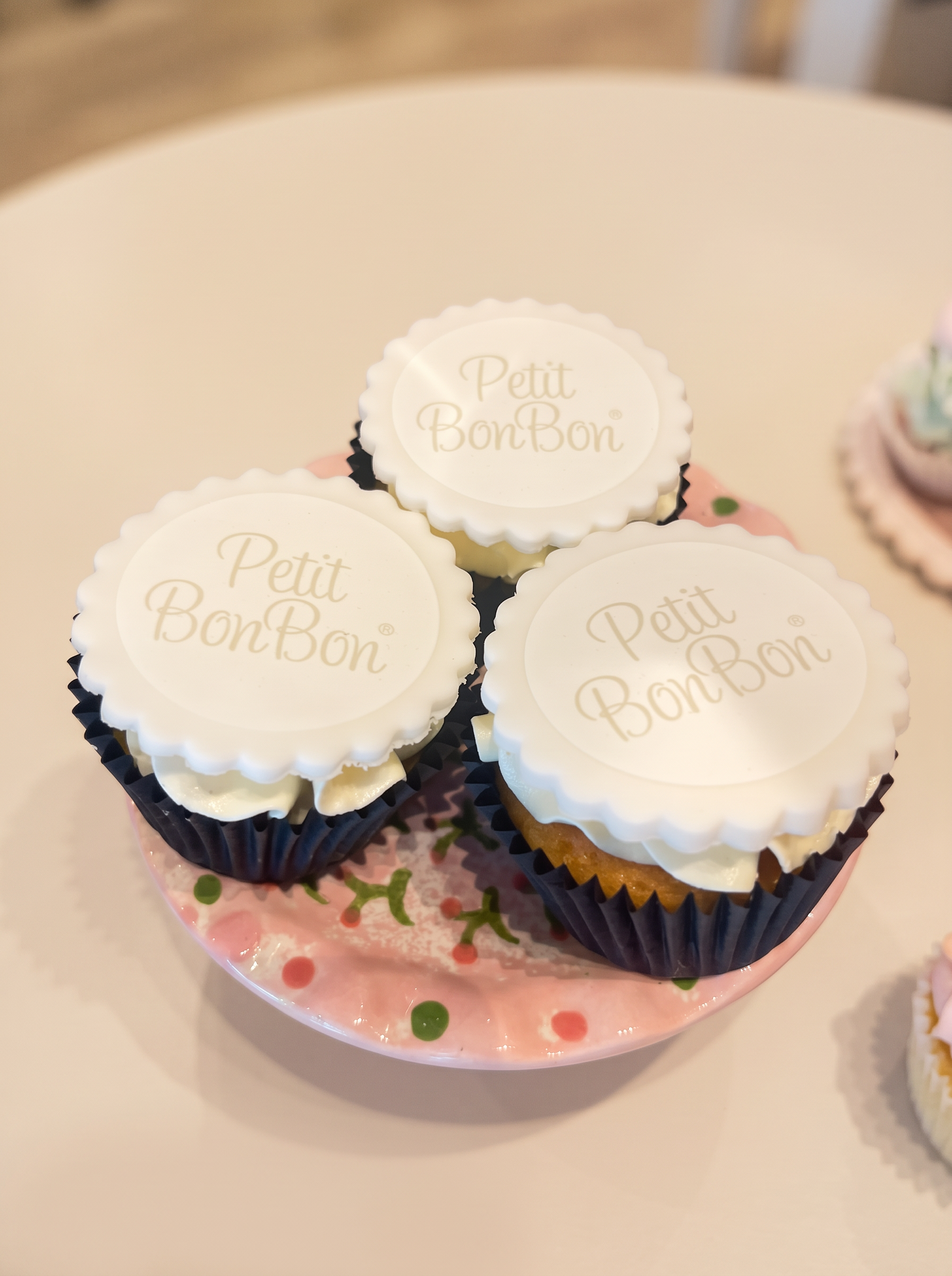 Petit BonBon cupcakes on a pink polka-dot plate for the boutique's third birthday