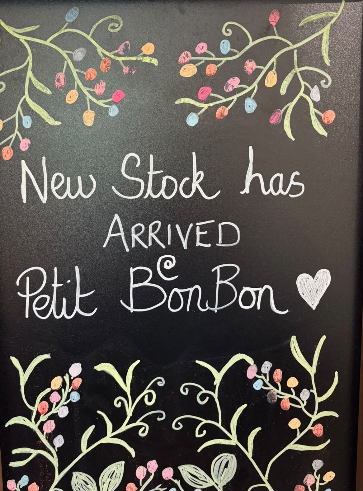 Chalkboard sign reading New Stock has arrived — Petit BonBon